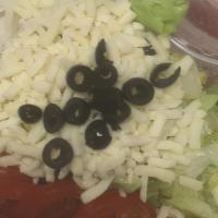 Small Dinner Salad · Lettuce, Tomatoes, Black Olives & Mozzarella Cheese served with house dressing (Creamy Itali...