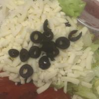 Large Dinner Salad · Lettuce, Tomatoes, Black Olives & Mozzarella Cheese served with house dressing (Creamy Itali...