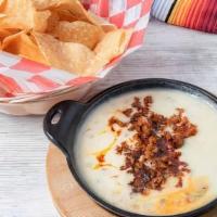 Queso Fundido · Melted jack cheese with corn tortillas.