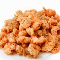 Louisiana Fried Crawfish Tails · A quarter pound of seasoned, lightly fried crawfish tails.