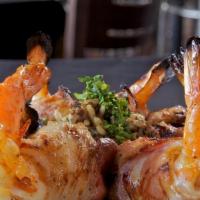 Shrimp Brochette  · Gulf Coast Shrimp wrapped in smoked bacon, stuffed with white cheese and jalapeno, served wi...