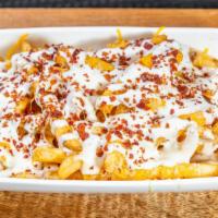 Cheese Fries · Spanky's fries topped with melted shredded cheese, bacon crumbles and ranch.