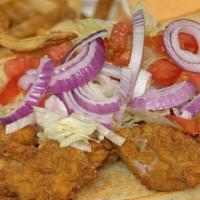 Seafood Po Boy · Choice of fried shrimp or fried oysters, topped with lettuce, tomato, and onion on a toasted...