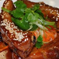 Baby Back Ribs · Tender, wok braised in chef's special sweet and sour sauce.