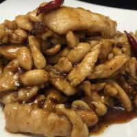 Kung Pao Chicken · Spicy. Sliced chicken white meat sauteed with peanuts and red chili pepper in the spicy kung...
