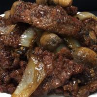 Black Pepper Steak · Tender steak slices sautéed with mushrooms and onions in black pepper sauce
