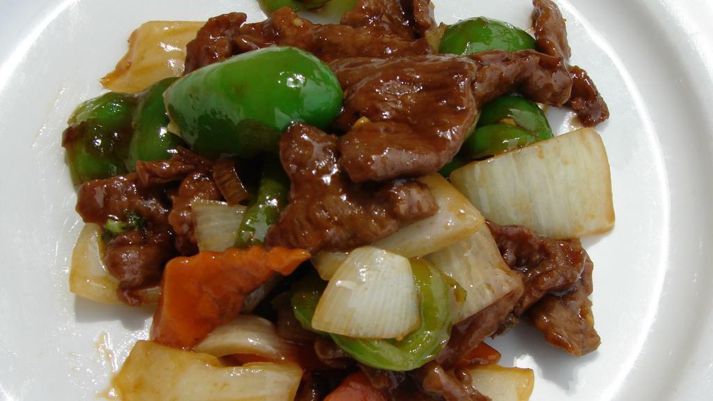 Bell Pepper Steak · Thinly sliced beef marinated and sauteed with green bell peppers and onions in a brown sauce.