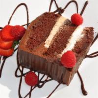 Chocolate Fantasy · Rich chocolate cake filled with white chocolate and moca mousse, topped with chocolate genoi...