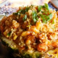 Pineapple Explosion · Grilled half pineapple stuffed with fried rice. Options of grilled chicken, grilled shrimp, ...