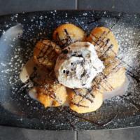 Fried Oreos · With cookies and cream ice cream.