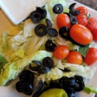 Italian Dinner Salad · Fresh crisp greens olives tomato and pepperoncini.