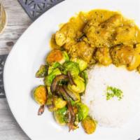 Curry Chicken · Chicken braised in philipose’s curry with white rice and mixed vegetables.