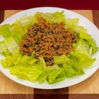 Tabbouleh Salad · Bulghur, Italian parsley, tomato paste, natural lemon juice.