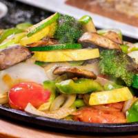 Grilled Veggies Fajitas · Zucchini, yellow squash, broccoli, and mushrooms grilled with tomatoes, onions, and green pe...