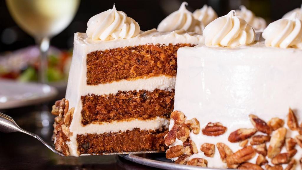 Carrot Cake · Chef Francisco’s famed recipe starts with crushed pecans and fresh, shredded carrots baked in two mouthwatering layers of moist spice cake, then finishes with a luscious, made from scratch cream cheese icing.