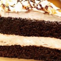 New!! Chocolate Mocha Cake · Moist chocolate cake with hints of coffee and Kahlua separated by a layer of mocha cheesecak...