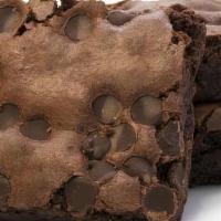 Chocolate Chunk Brownies · Gluten Free chocolate brownie with chocolate chunks mixed in.