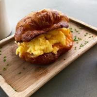 Egg & Cheese Croissant · Butter croissant, scrambled egg, cheddar cheese, chives, hot sauce.