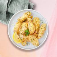 Go Go Garlic Parmesan Wings · Breaded or naked fresh chicken wings, fried until golden brown, and tossed in garlic and par...
