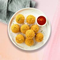 Mac N Cheese Maniac Bites · 10 Bite-size clumps of mac and cheese breaded and fried until golden brown. Served with your...