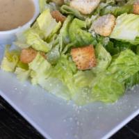 Caesar Salad · Romaine, parmesan cheese, toasted basil croutons with Caesar dressing.