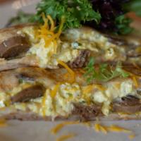 Breakfast Crepe · Contains nuts. Scrambled eggs, cheddar cheese, merguez Moroccan sausage.