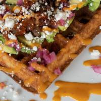 Avocado Toast Waffle · Sliced avocado, oven-roasted tomatoes, goat cheese, red onions capers, and chipotle glaze.