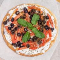 Labne Bread · Creme of yogurt with tomato and black olives on top.