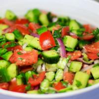 Israeli Salad · Diced tomatoes, cucumbers, and red onions. Served on a bed of lettuce, topped with Israeli d...
