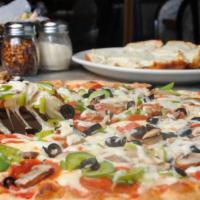 Veggie Pizza · Topped with mushrooms, tomatoes, green peppers, onions, and olives.