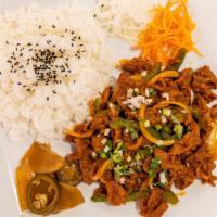 Spicy Pork Bulgogi Platter · Thinly sliced pork marinated in gochujang spicy chili paste and grilled with vegetables, ser...