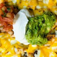 Nacho Plater · Crispy corn chips covered with refried beans and melted Mexican cheese. Served with guacamol...