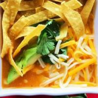 Sopa Tortilla · Mexican chicken broth with cream and mixed vegetables. Served with crispy corn tortilla stri...