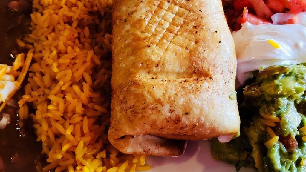Chimichanga · A large flour tortilla rolled with your preference and lightly deep fried. Served with refried beans, mexican rice, pico de gallo, guacamole and sour cream.
