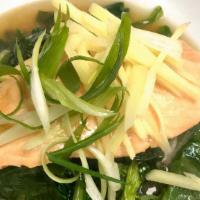 Steamed Salmon · With sesame ginger soy sauce and spinach.
