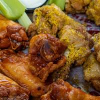 Wangs - 20 · Jumbo wings tossed with your choice of sauce. Served with celery and house made ranch.