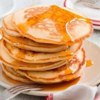 Plain Pancakes · Two large buttermilk pancakes served with butter and syrup.