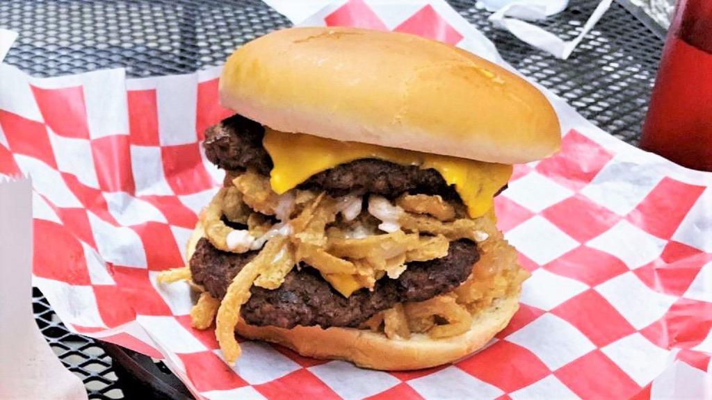 Loaded Double Cheese Burger · Two 3.5 Oz Ground beef Patties, american cheese, battered & fried onion & jalapeno slices, ranch , pickles and Loaded sauce