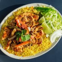 Rice And Chicken Steak · Basmati rice cooked with goat broth and served with middle eastern-style grilled chicken ste...