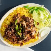 Rice And Philly Steak · Basmati rice cooked with goat broth and served with middle eastern-style grilled Philly Steak.