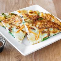 Pa Jun · Crispy Korean scallion pancakes with squid served with a house dipping sauce.