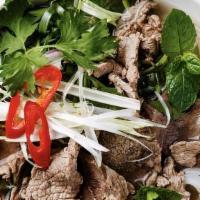 Noodle Bar (Vietnamese Pho) · Boiling beef bone broth is poured over a bed of soft rice noodles with your choice of protei...