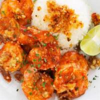Hawaiian Garlic Shrimp · Cooked in garlic buttery sauce, served with rice and salad.