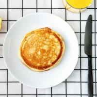 Labc Pancakes · Two fluffy pancakes served with a side of butter and syrup. Morning sunshine.