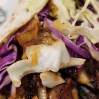 Beef Brisket Wraps · Beef brisket, rice & beans, cheese, & a sprinkling of thin strips of raw cabbage, wrapped in...