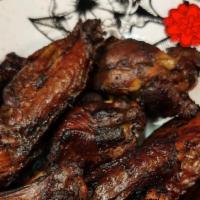 Jerk Chicken Wings · Slow cooked over a wood fire