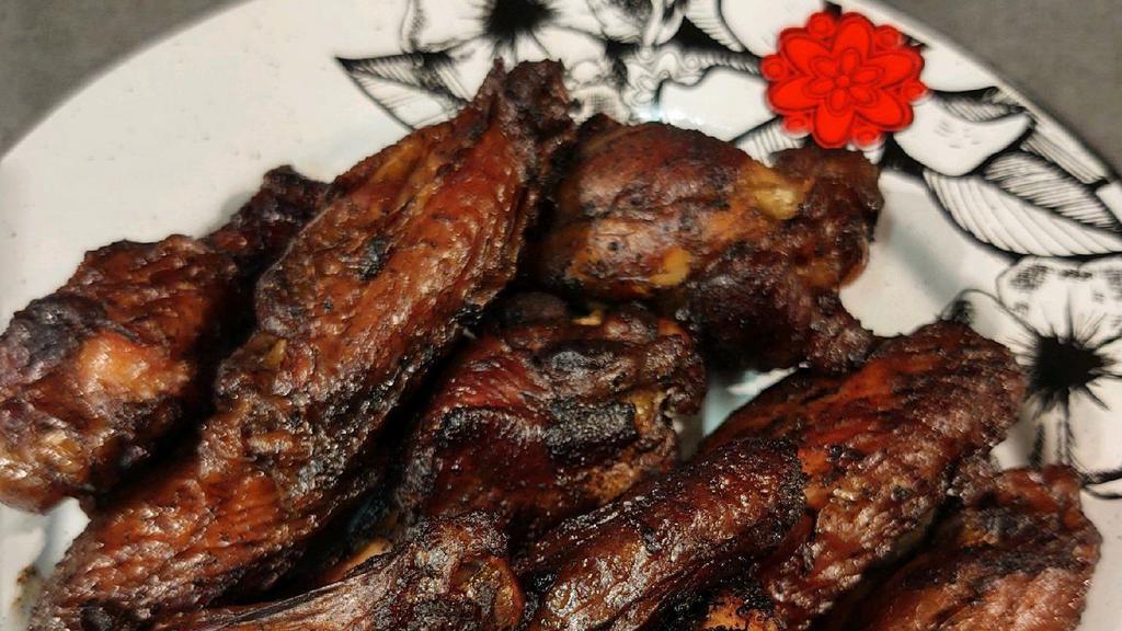 Jerk Chicken Wings · Slow cooked over a wood fire
