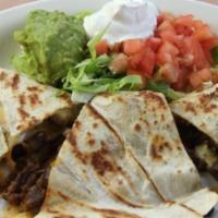 #41) Large Quesadilla · Beef or chicken fajita, lettuce, sour cream, and guacamole.