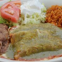 #13) Enchiladas Verdes Lunch Plate · Green enchiladas, cheese, or chicken, rice, beans, Monterrey Jack cheese, sour cream, and sa...