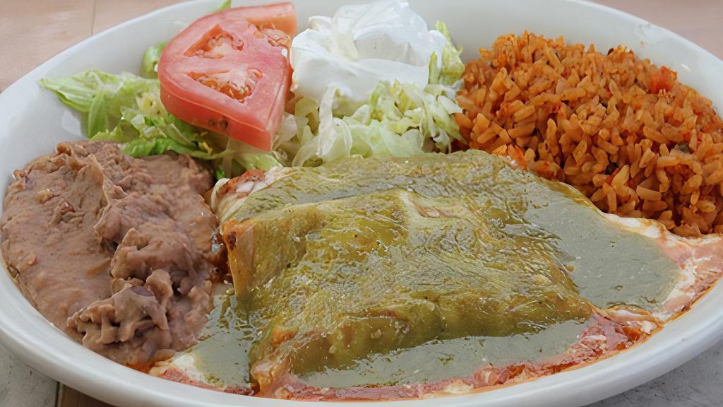 #13) Enchiladas Verdes Lunch Plate · Green enchiladas, cheese, or chicken, rice, beans, Monterrey Jack cheese, sour cream, and salad.